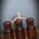 Trio round brown apothecary bottles
