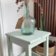 Antique almond green wooden stool