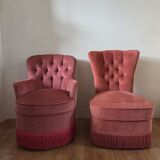A pair of small tub chairs.