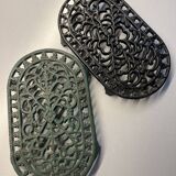 Duo of antique cast iron table mats