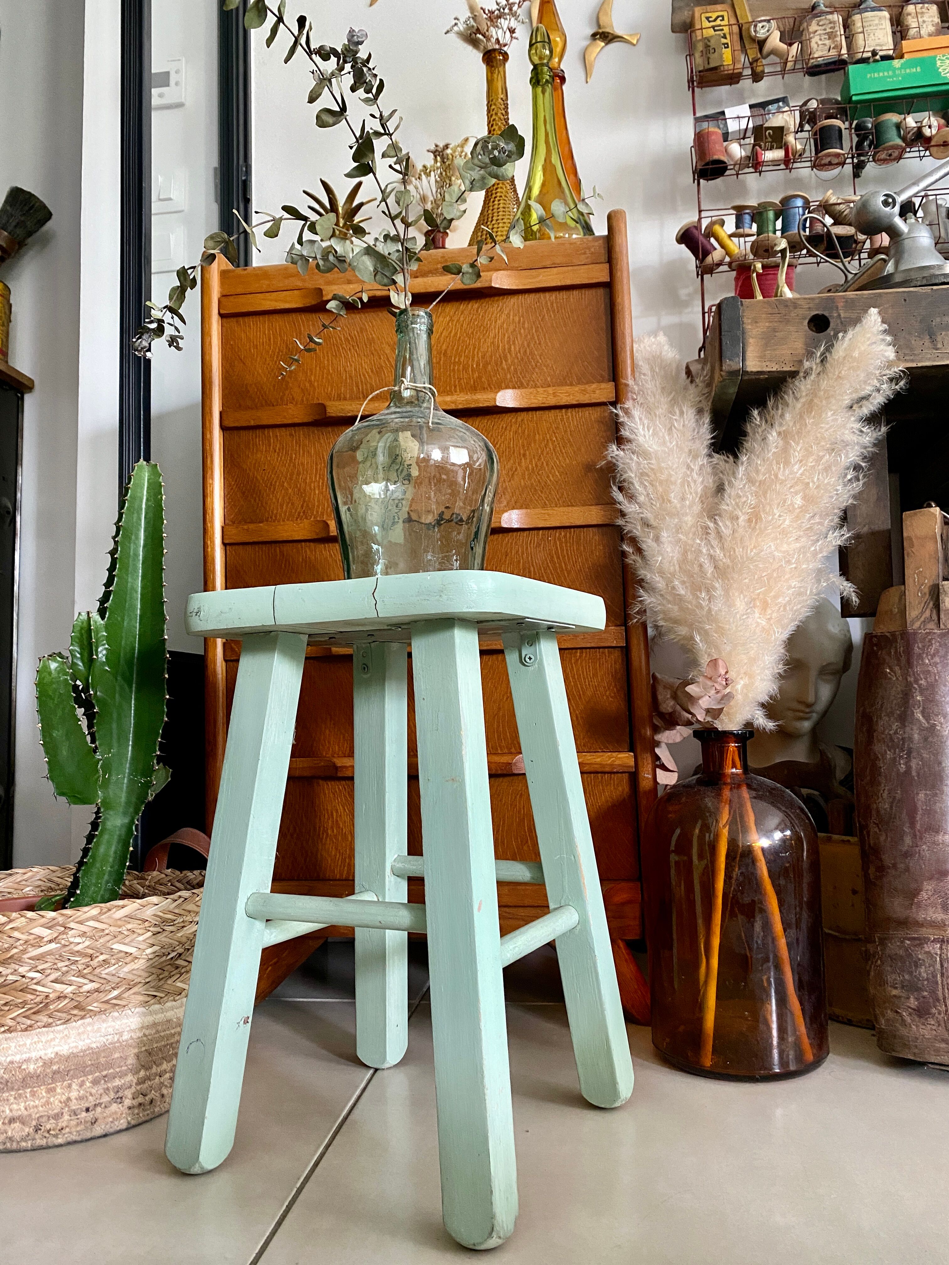Old almond green wooden stool