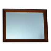 Miroir biseauté en bois sculpté et contour doré
