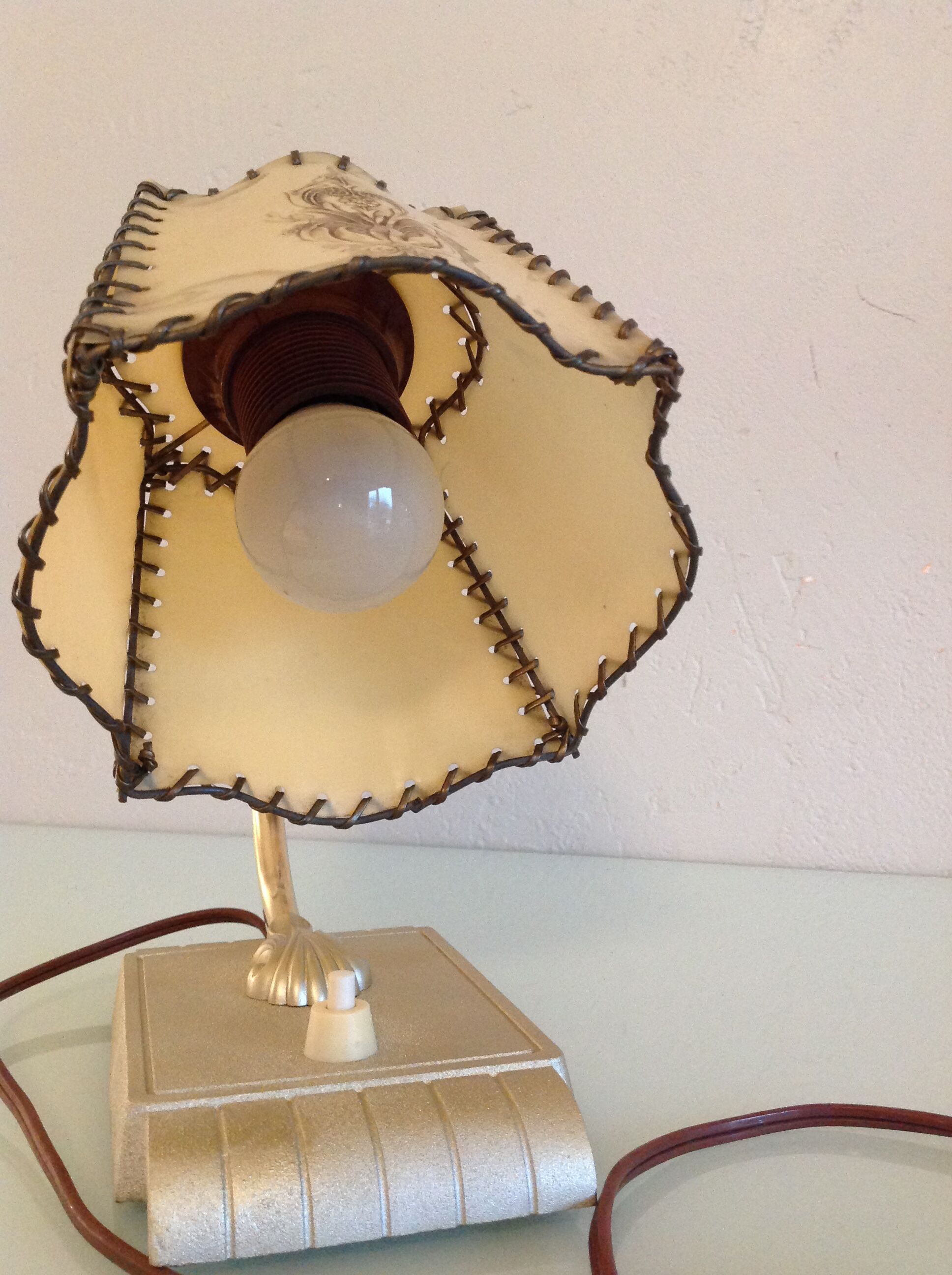 Brass bedside lamp and beige lampshade art deco style