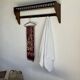 Antique wooden wall shelf with a turned gallery and 5 hooks L120 H40 D18