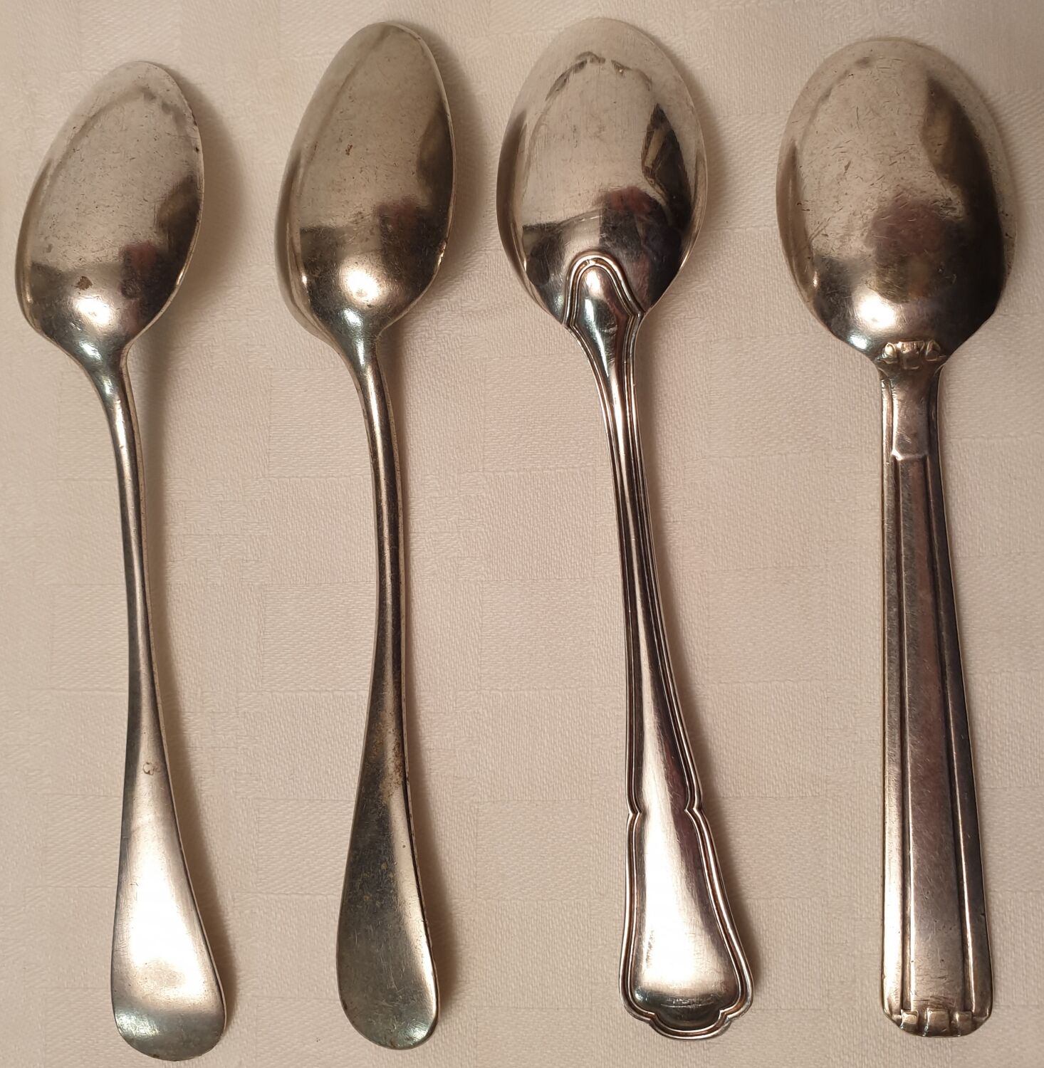 Set of mismatched silvered metal cutlery