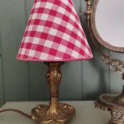 Pair of small lamps in gilded bronze by Petitot and red gingham lampshades.