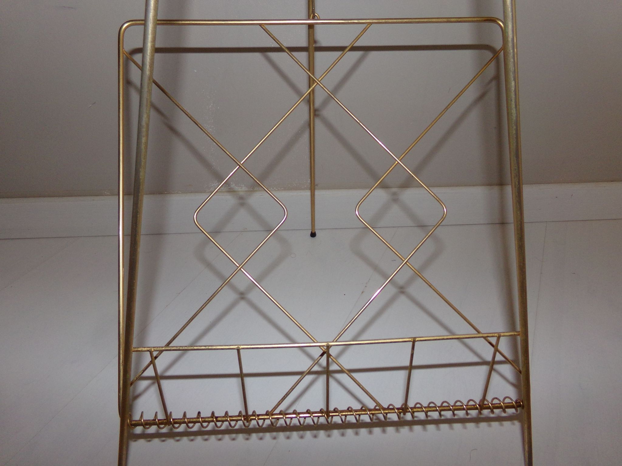 Vintage magazine holder in gold metal