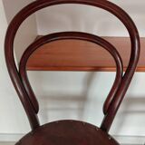 pair of round bistro chairs with a pattern on the seat, vintage