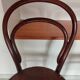 pair of round bistro chairs with a pattern on the seat, vintage
