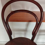 pair of round bistro chairs with a pattern on the seat, vintage