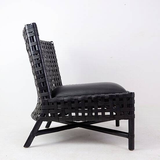 Pair of black woven leather lounge chairs