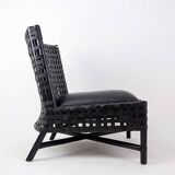 Pair of black woven leather lounge chairs