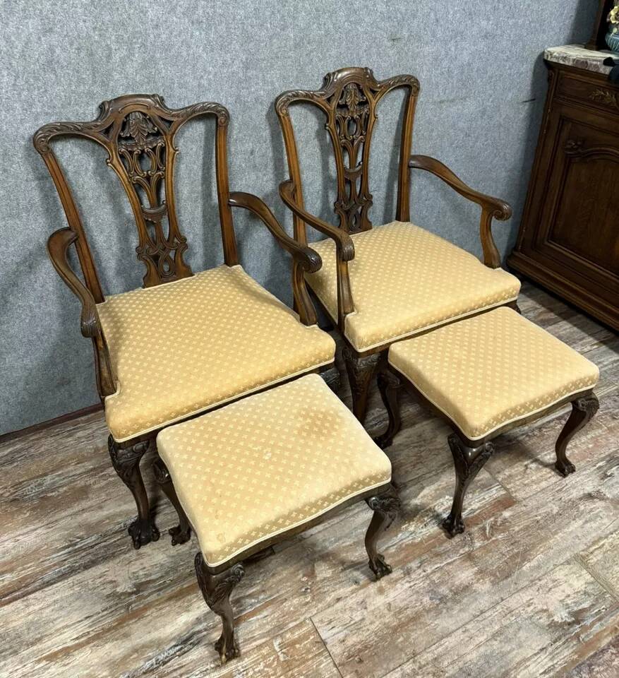 Pair of English armchairs with mahogany footrests circa 1850