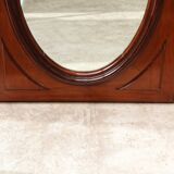 Oval mirror in beveled glass and solid mahogany