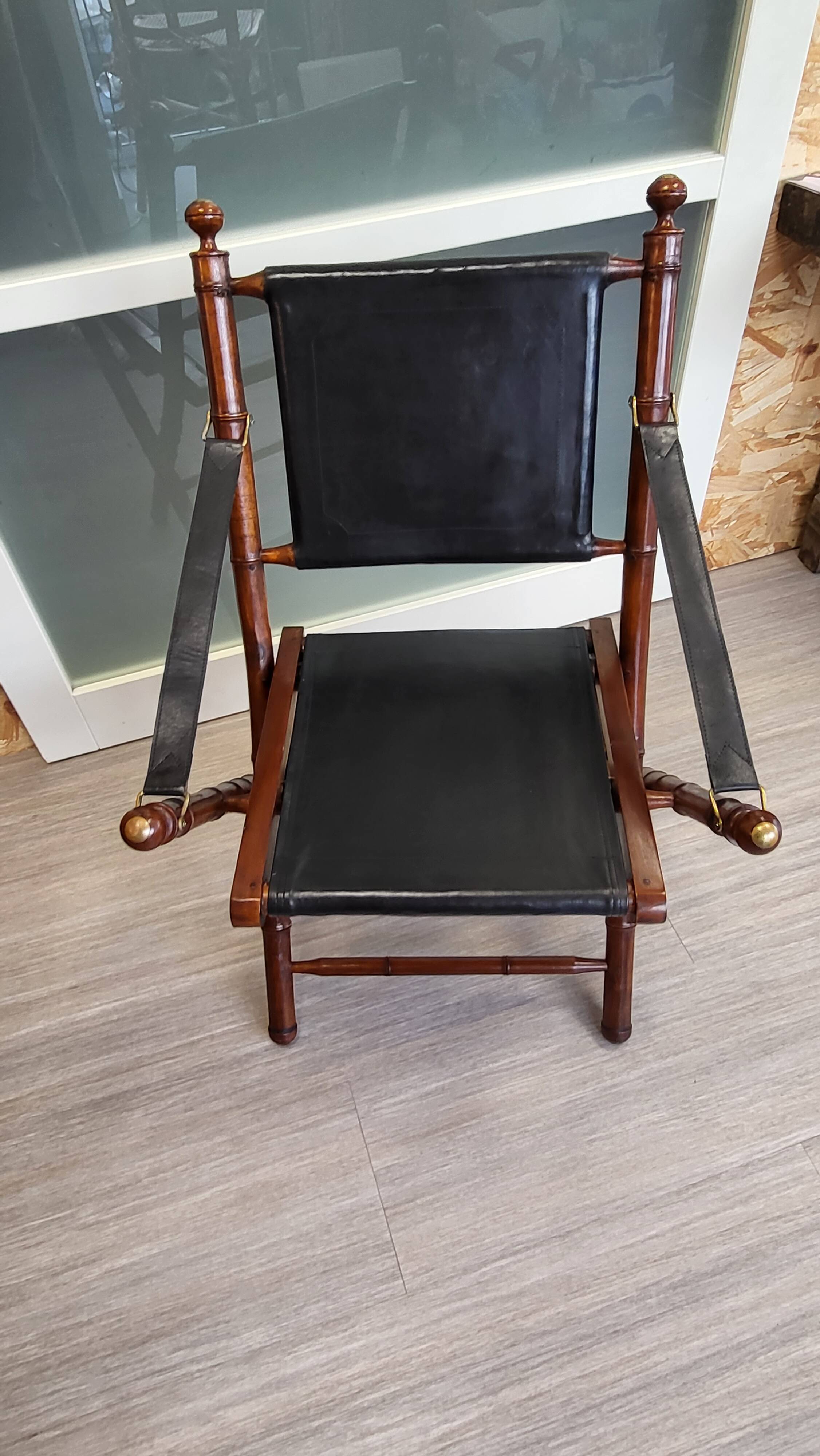 Colonial style folding leather and teak armchair