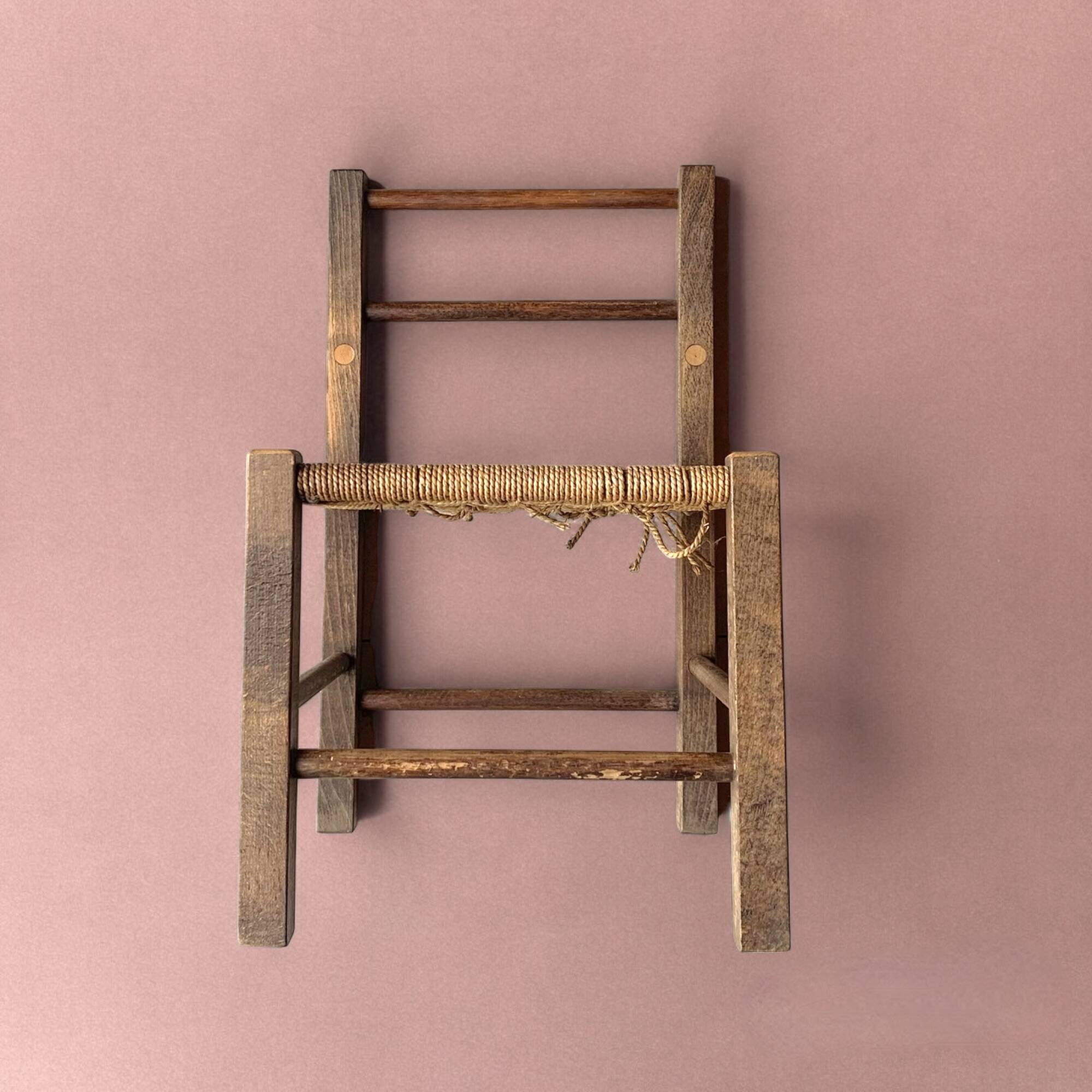 Vintage children's chair made of rope and wood