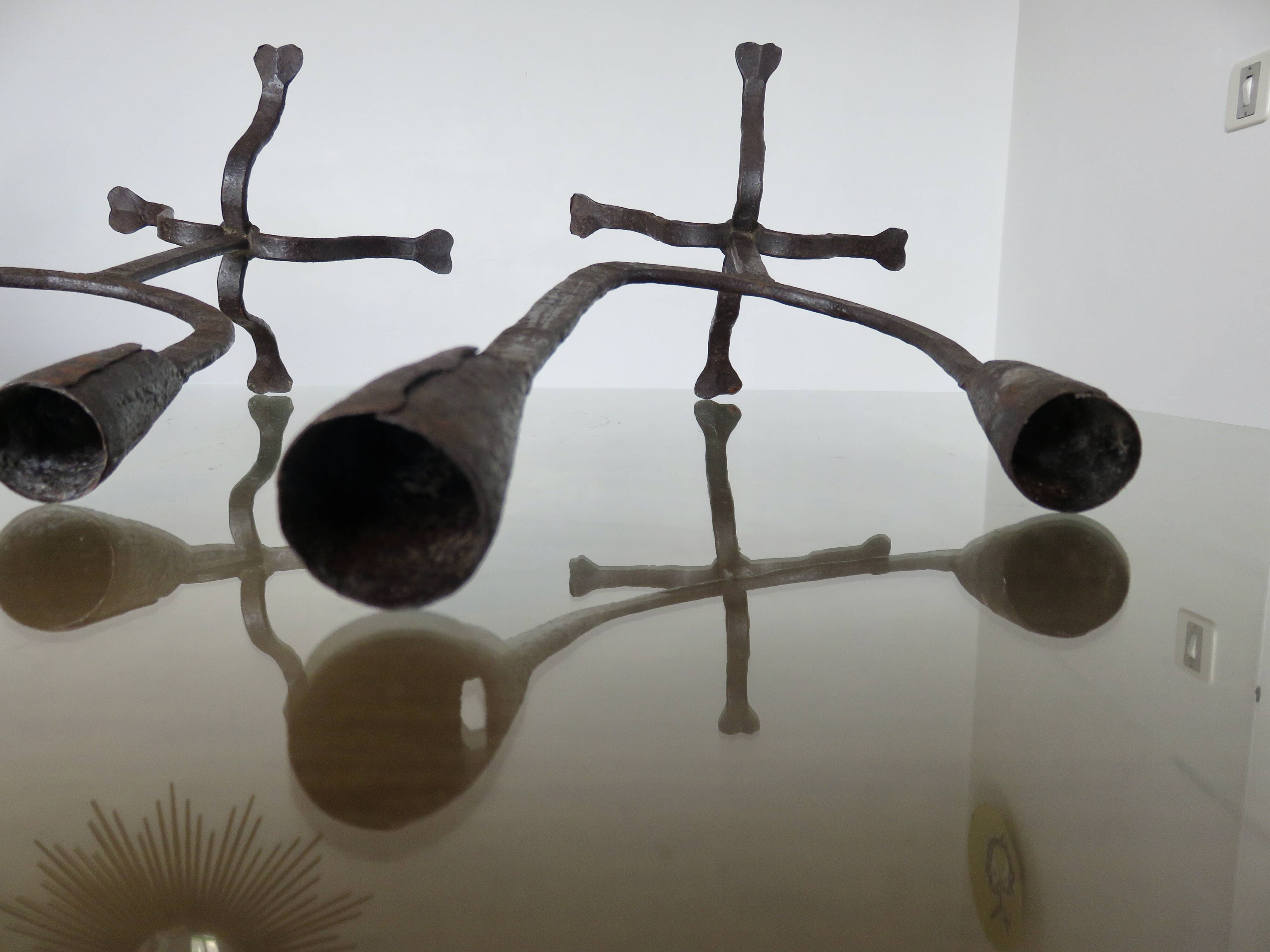 Pair of antique wrought iron candlesticks