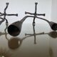 Pair of antique wrought iron candlesticks