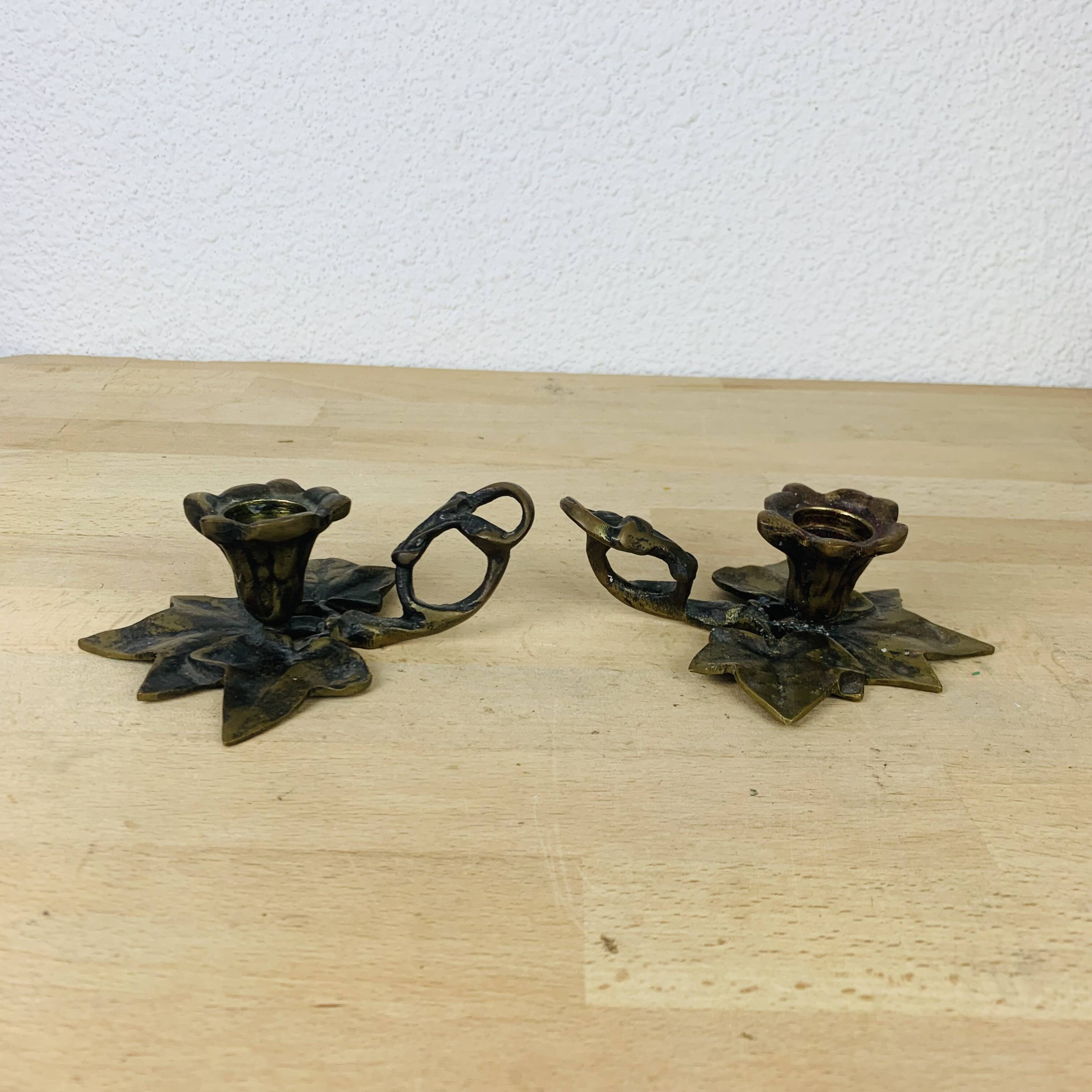 Pair of brass flower candlesticks, cellar