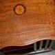 Sheraton-style rotating library table in walnut and satinwood.