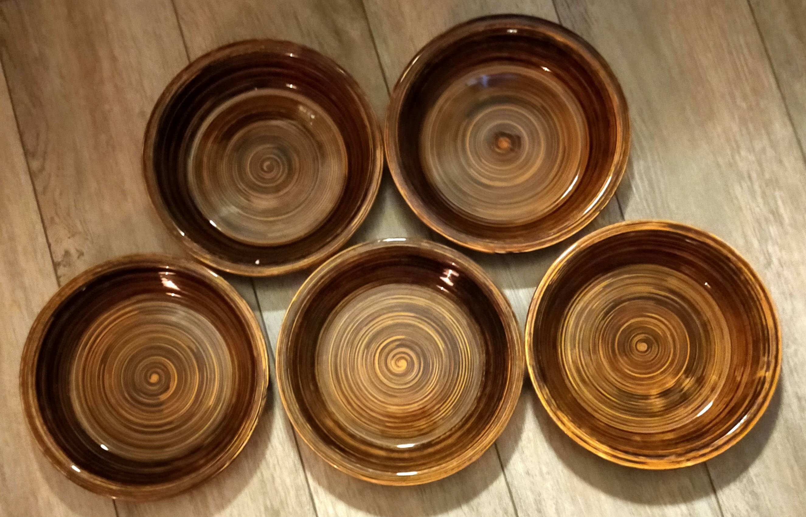 Set of five deep caramel brown plates. Paimpol