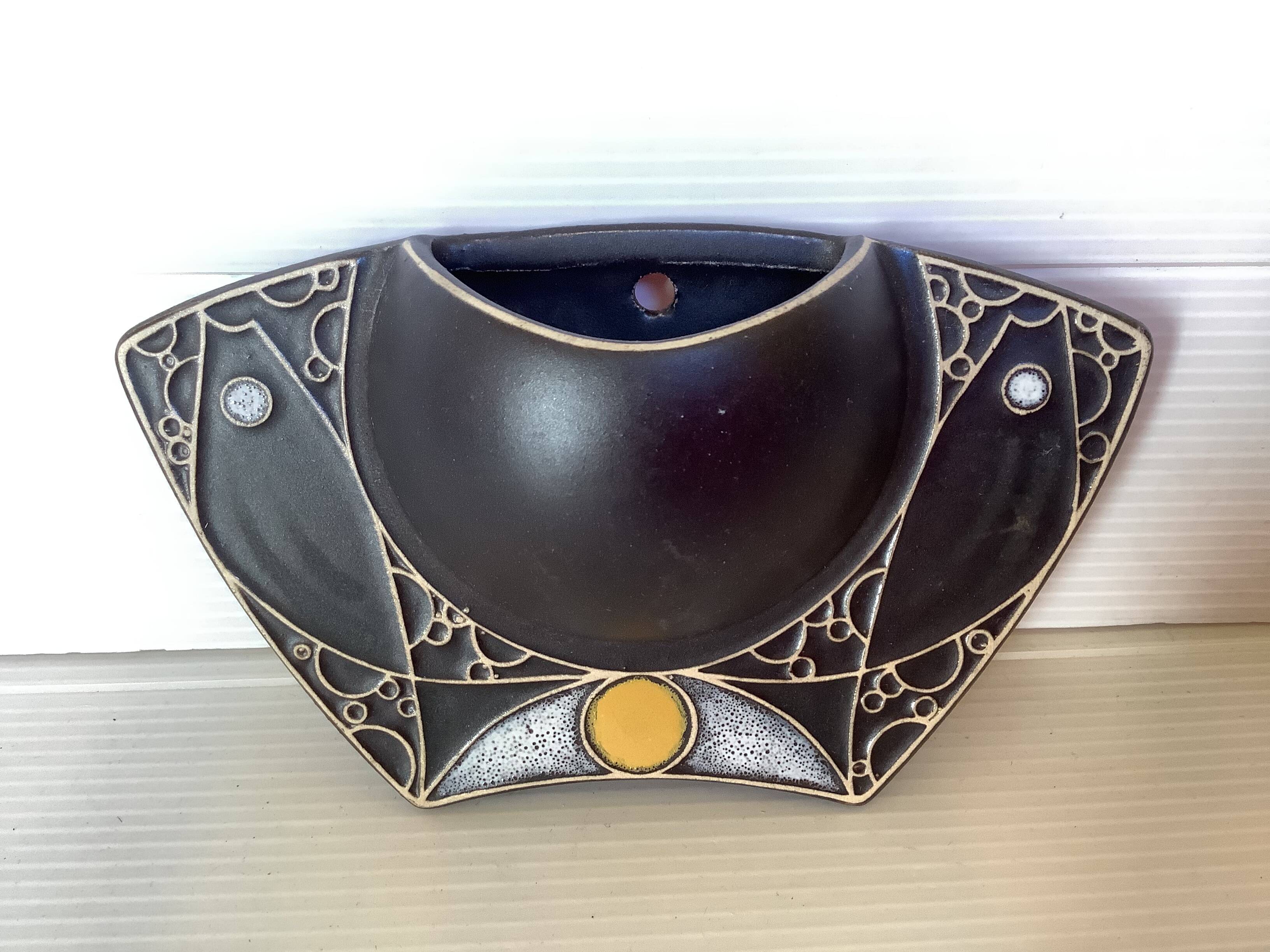 Asymmetrical black flower vase