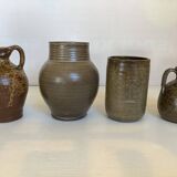 Eight brown ceramic pitcher vases