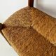 Old wooden and straw bench