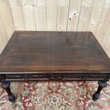 Middle table in a sculpted Louis XIII style living room.