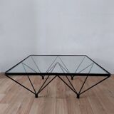 Glass coffee table with a metal frame.
