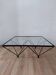 Glass coffee table with a metal frame.