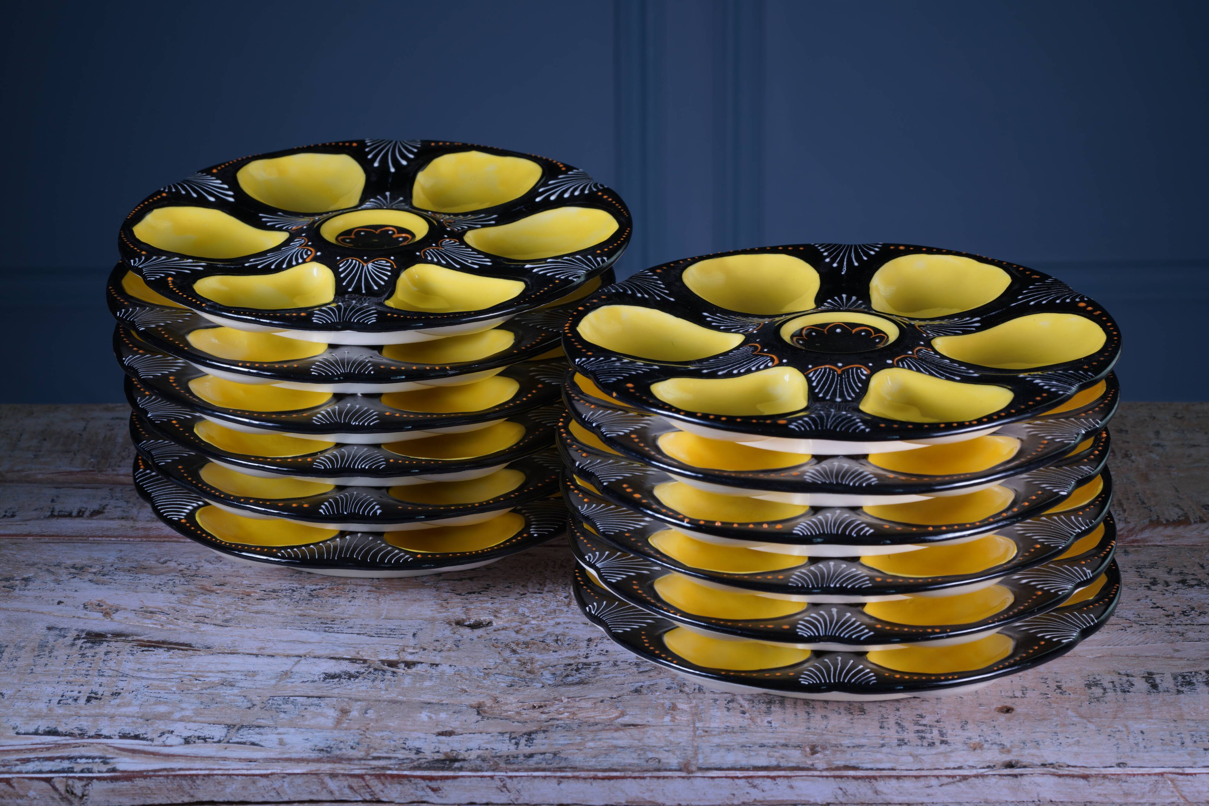 Set of twelve handpainted Brittany yellow, cream and black oyster plates