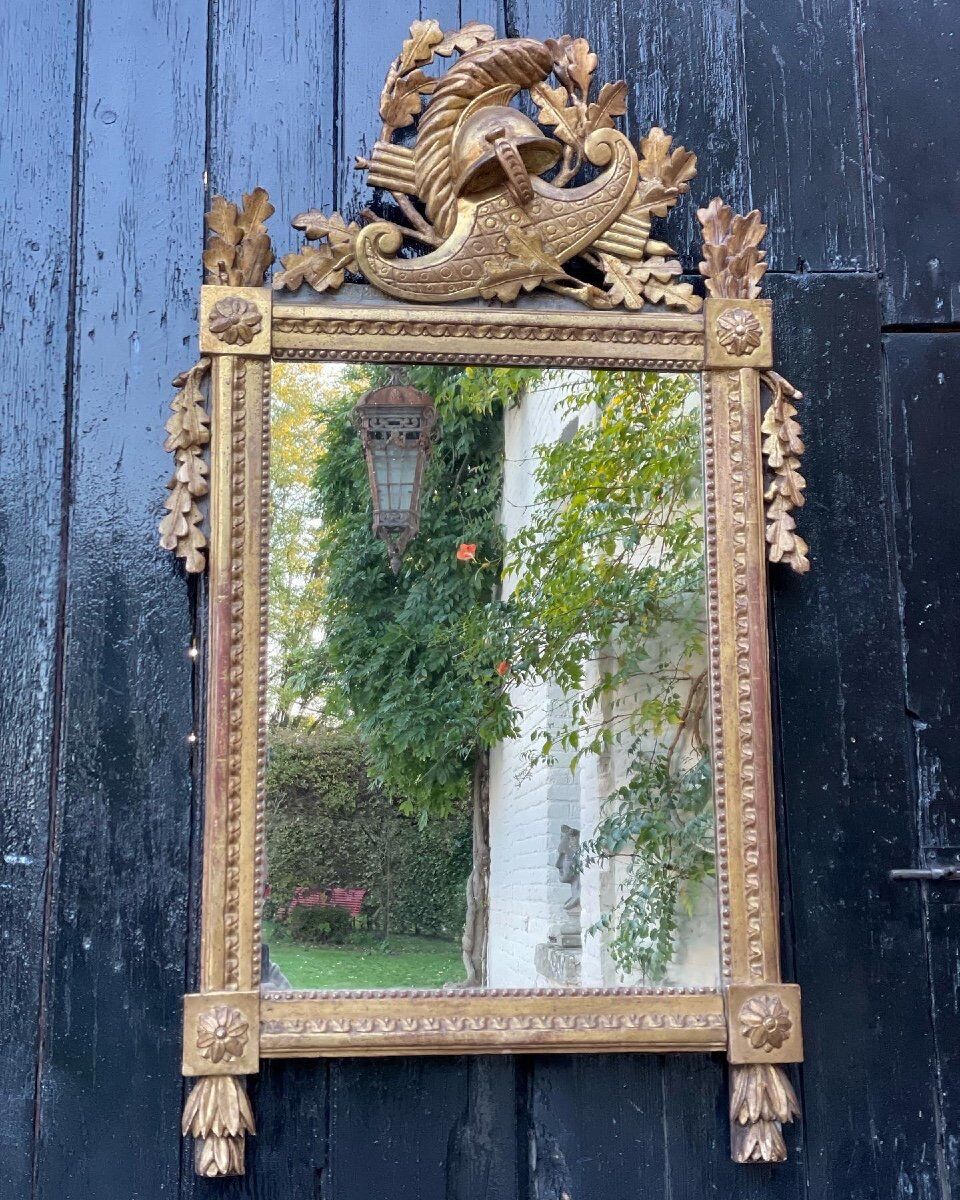 Louis XVI mirror in gilded carved wood, eighteenth century