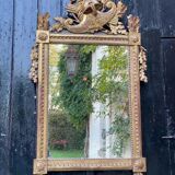 Miroir Louis XVl en bois sculpté doré, XVIIIème siècle