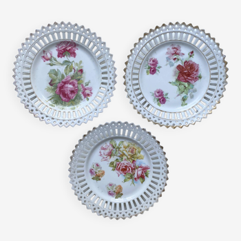 Three old openwork earthenware plates decorated with Roses and vintage gilding