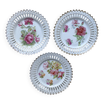 Three old openwork earthenware plates decorated with Roses and vintage gilding