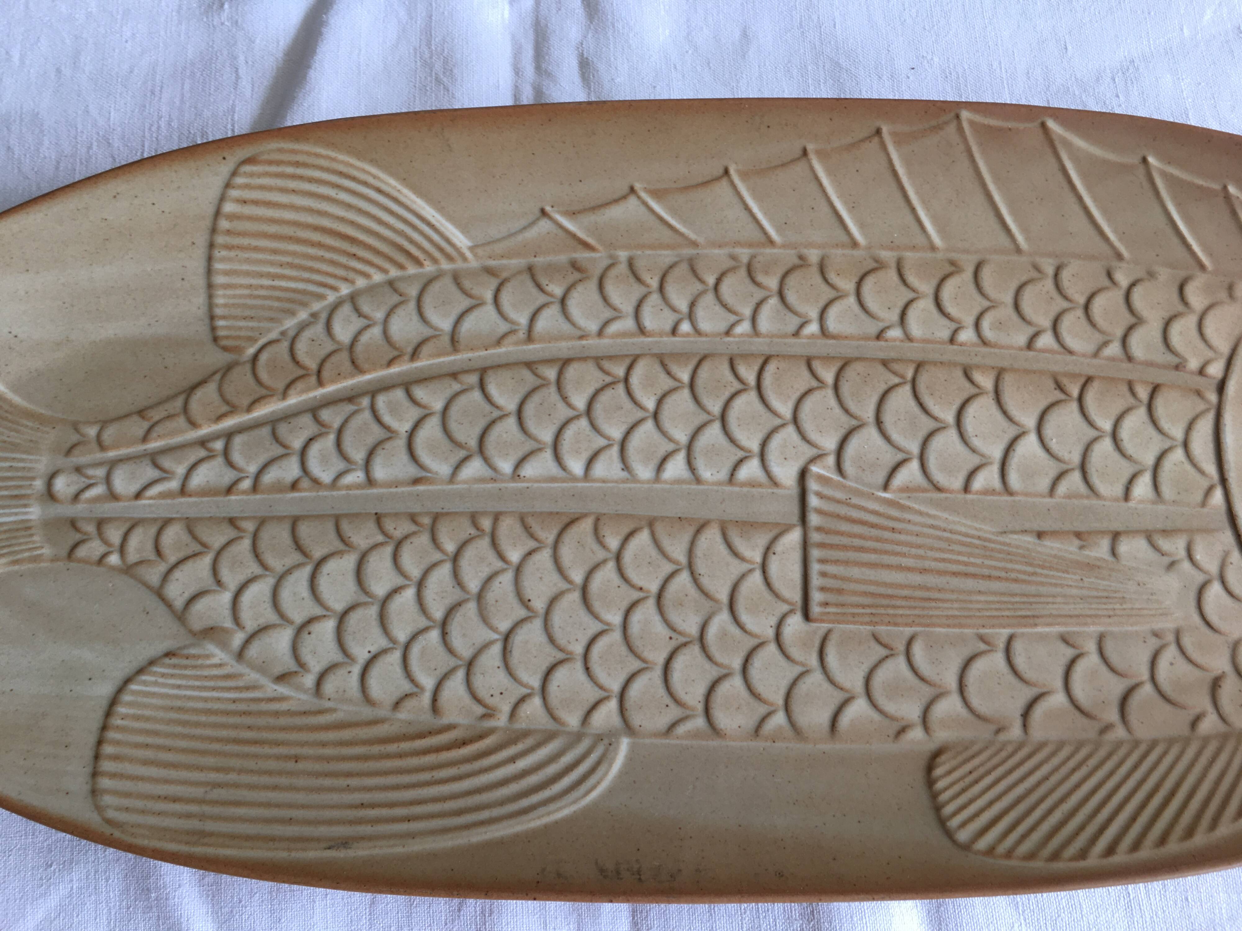 Very large fish dish stamped “Grès CNP Village France”