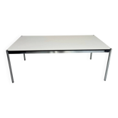 Grande table design USM Haller plateau blanc et structure chromée