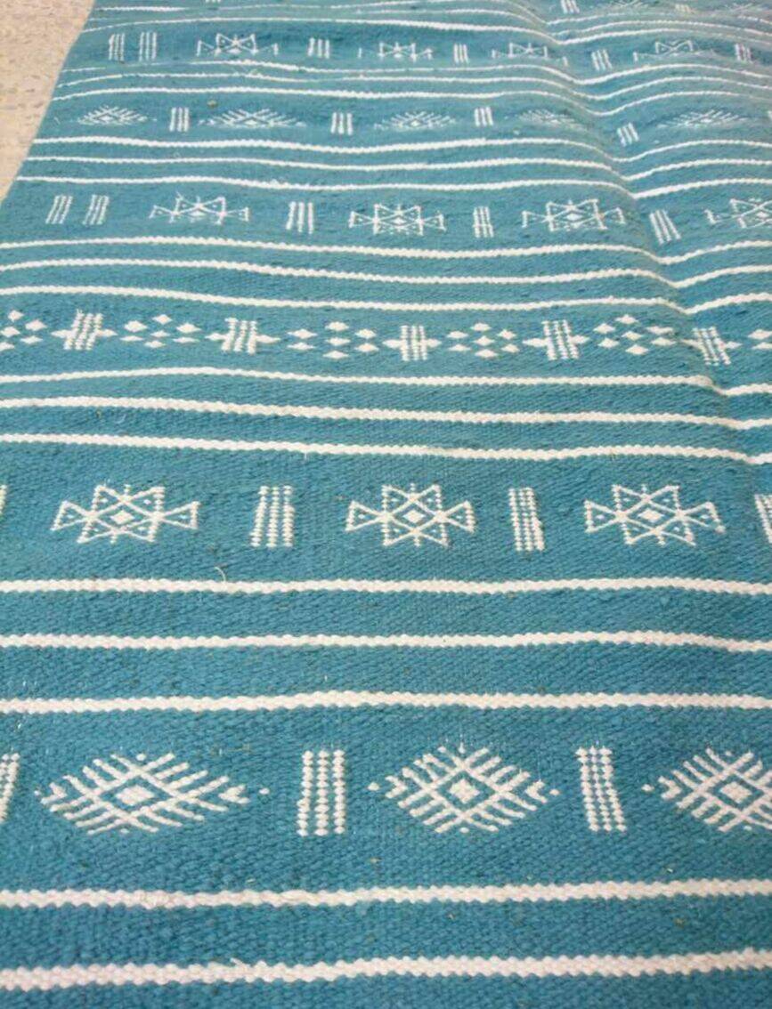 Hand-woven blue and white kilim rug in natural wool