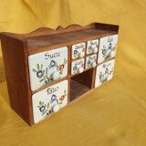 Vintage wooden spice rack with ceramic drawers