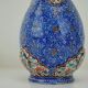Piriform vase with a flared metal collar enamelled with a polychrome decoration, marked "Amini Iran" on the reverse.