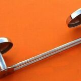 Former industrial-style wall coat rack