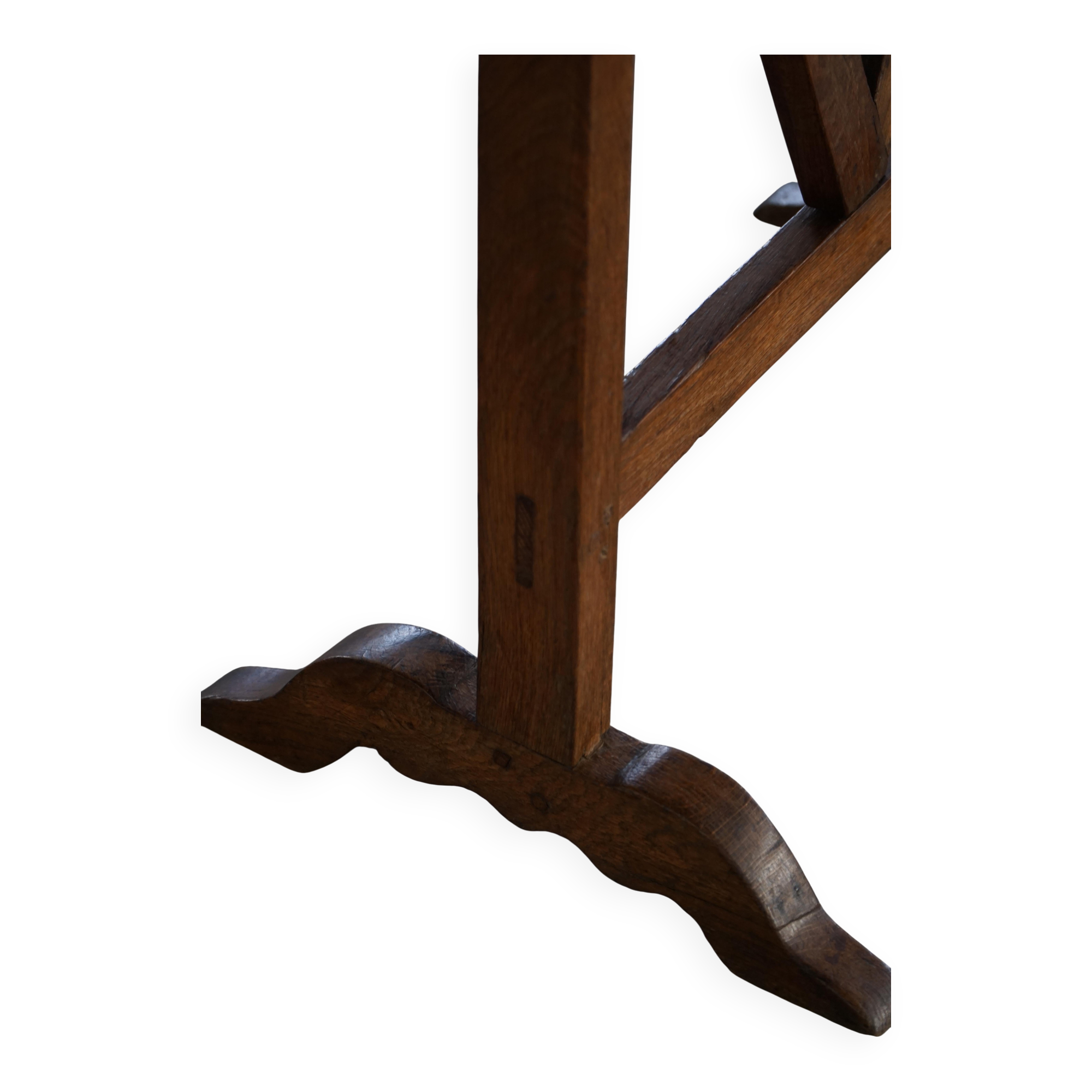 19th-century French round wine table with an adjustable top and floral textile surface.