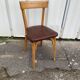 Chaise Baumann assise skaï