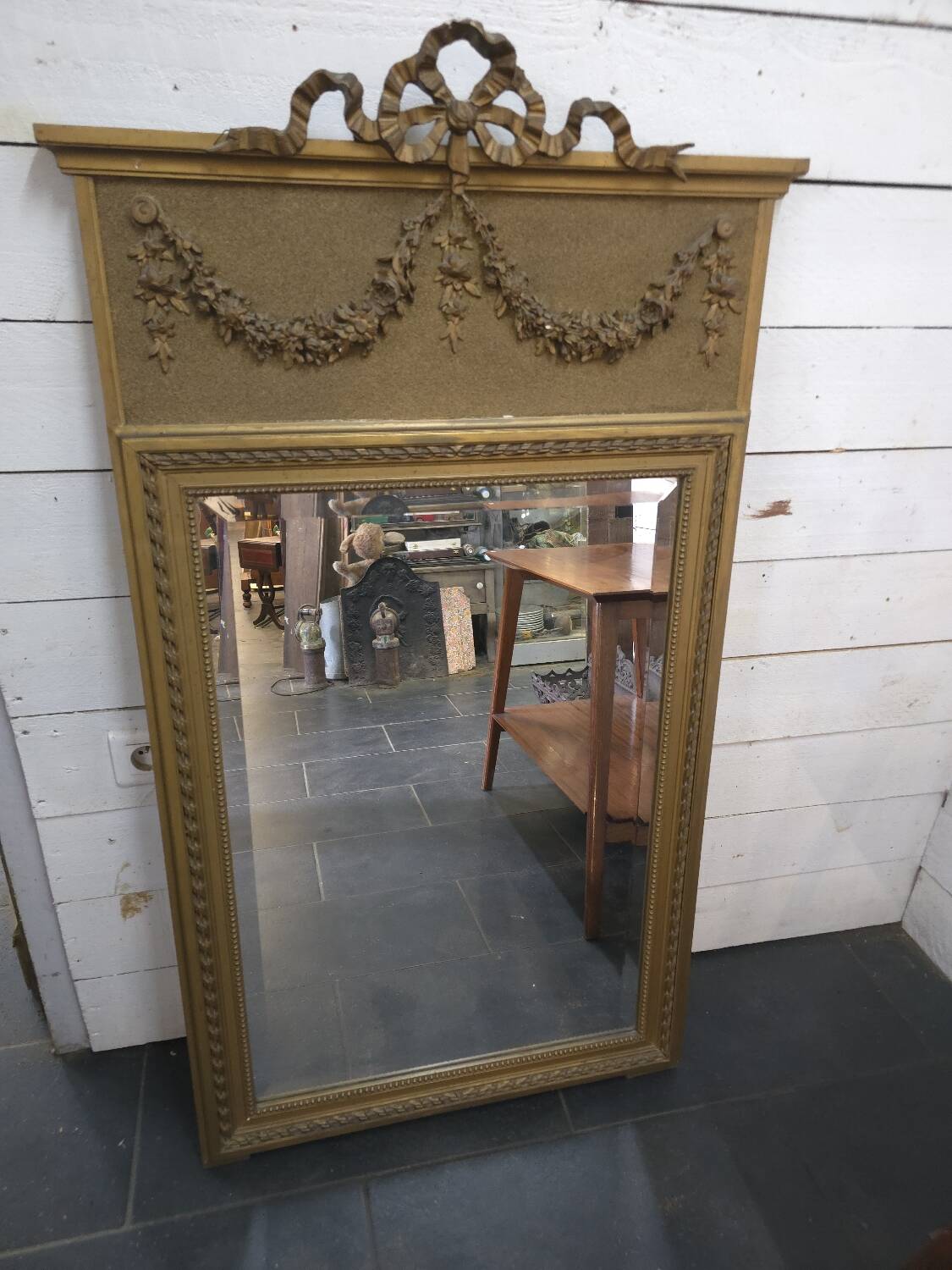 Gilded patinated trumeau mirror