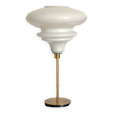 Table lamp with a matte white glass globe