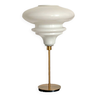 Table lamp with a matte white glass globe