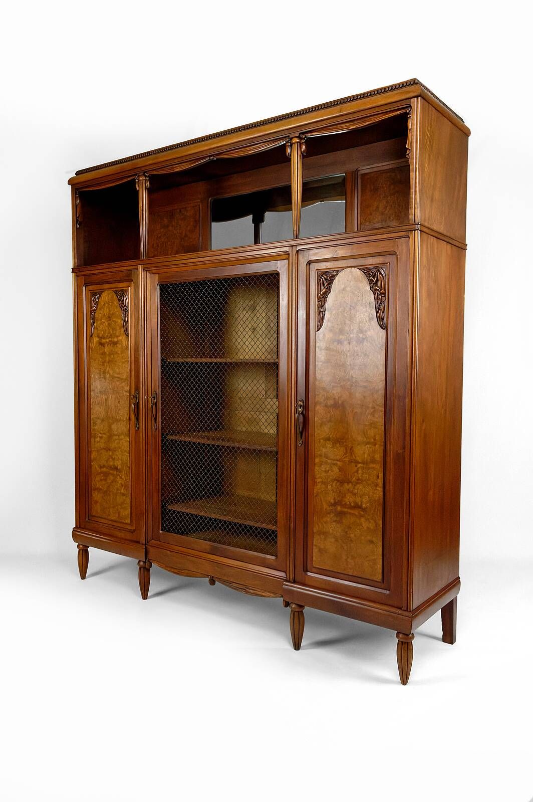 Art Deco showcase bookcase in carved walnut, France, circa 1925