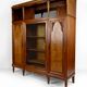Art Deco showcase bookcase in carved walnut, France, circa 1925