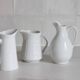 3 old French pitchers in white ceramic
